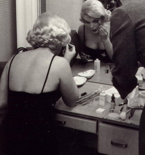The table in front of Marilyn shows these three Elizabeth Arden makeup items.